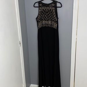 Formal, long, black dress with gold beaded detail over the bust in size 14